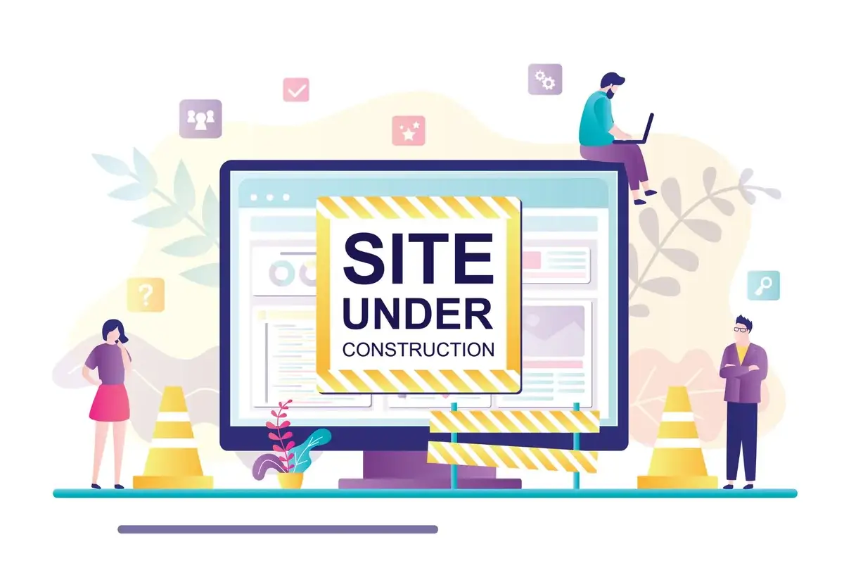 Illustration de création de site web : un écran en construction entouré de trois personnes.